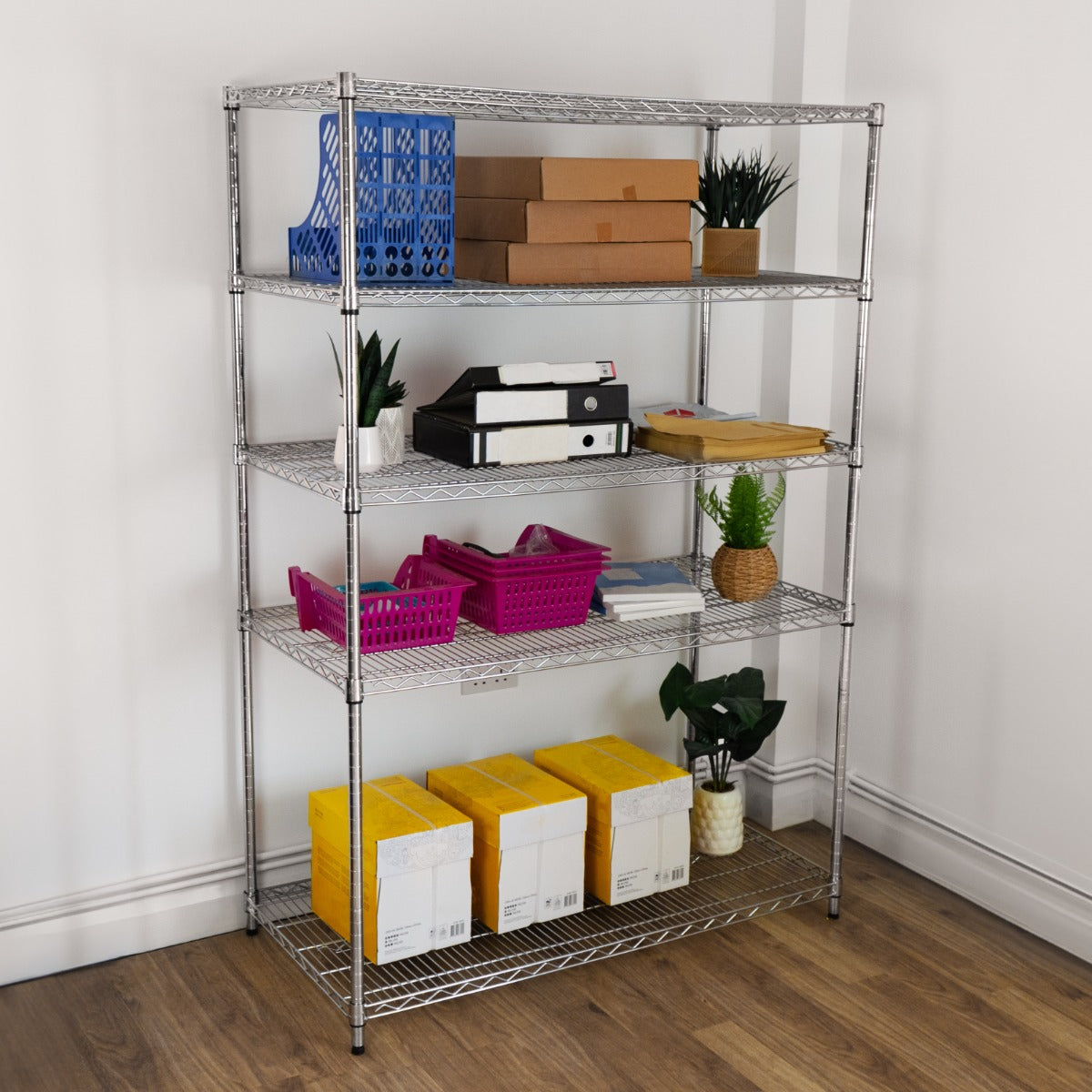 Metal wire racking unit with five shelves, featuring colorful storage bins, boxes, and potted plants, ideal for organization