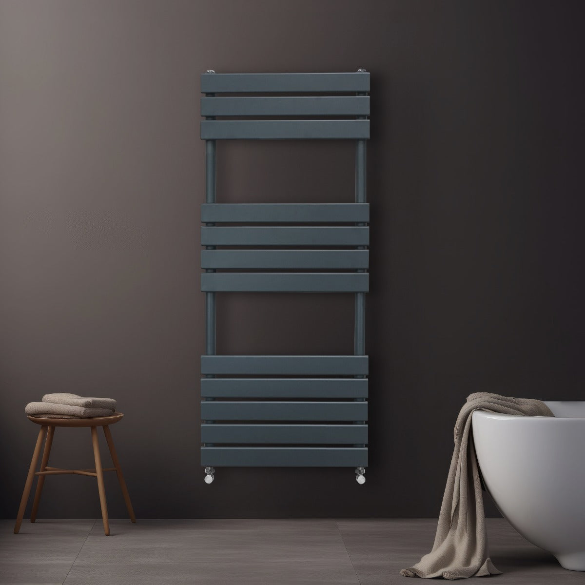 Sleek anthracite grey flat panel towel radiator, featuring horizontal slats, mounted on a dark wall beside a modern bathtub and stool