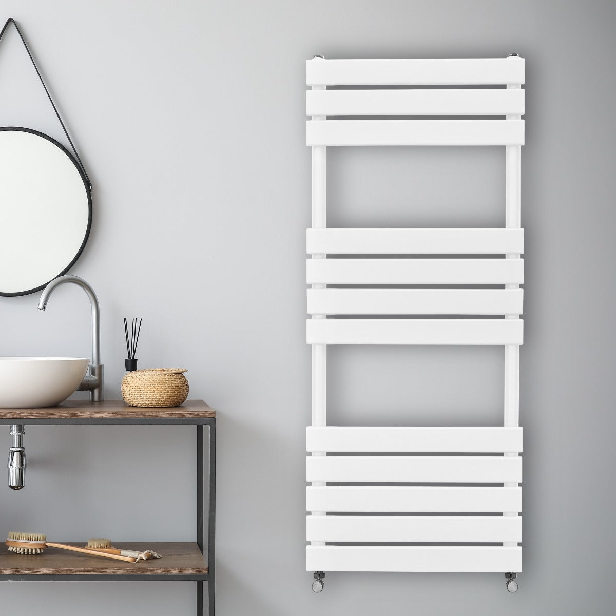 Sleek white flat panel towel radiator with horizontal slats, mounted on a light gray wall, enhancing modern bathroom decor