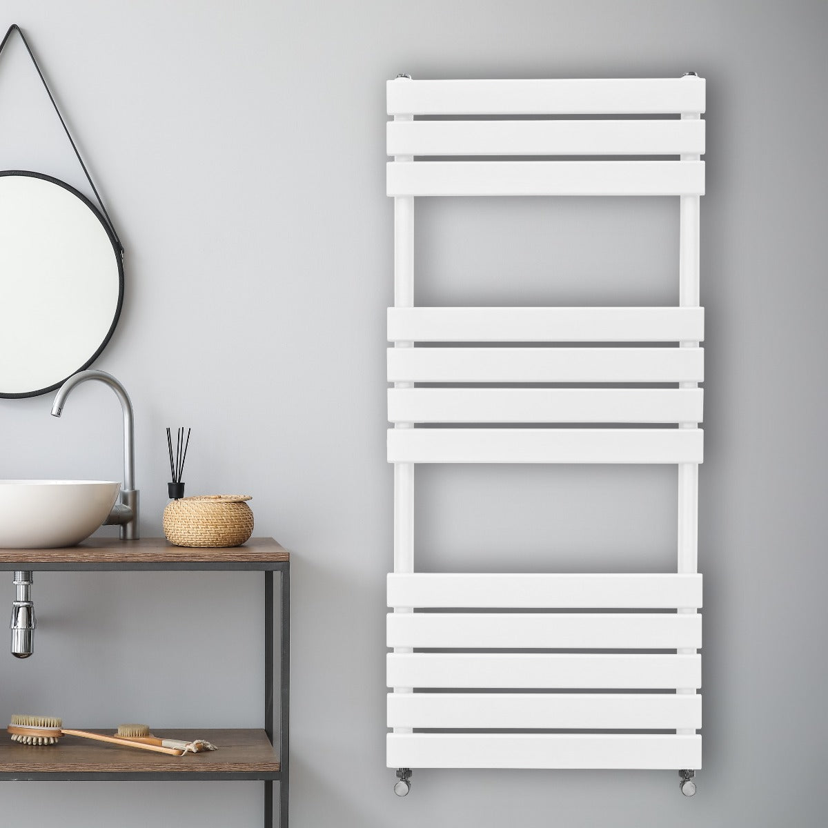 Sleek white flat panel towel radiator mounted on a gray wall, featuring horizontal slats and a modern design for stylish heating