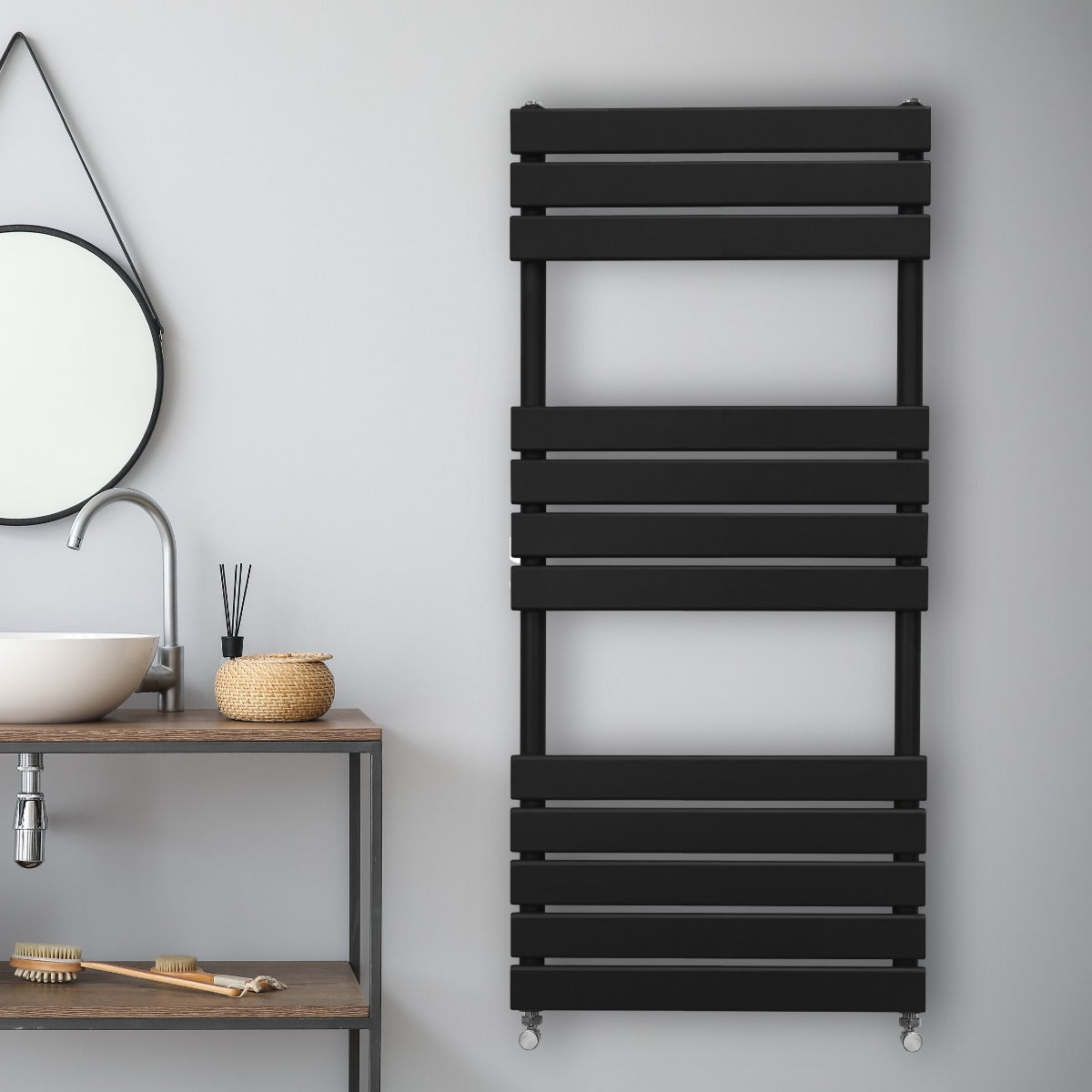 Sleek black flat panel towel radiator mounted on a light gray wall, featuring horizontal slats and modern design elements