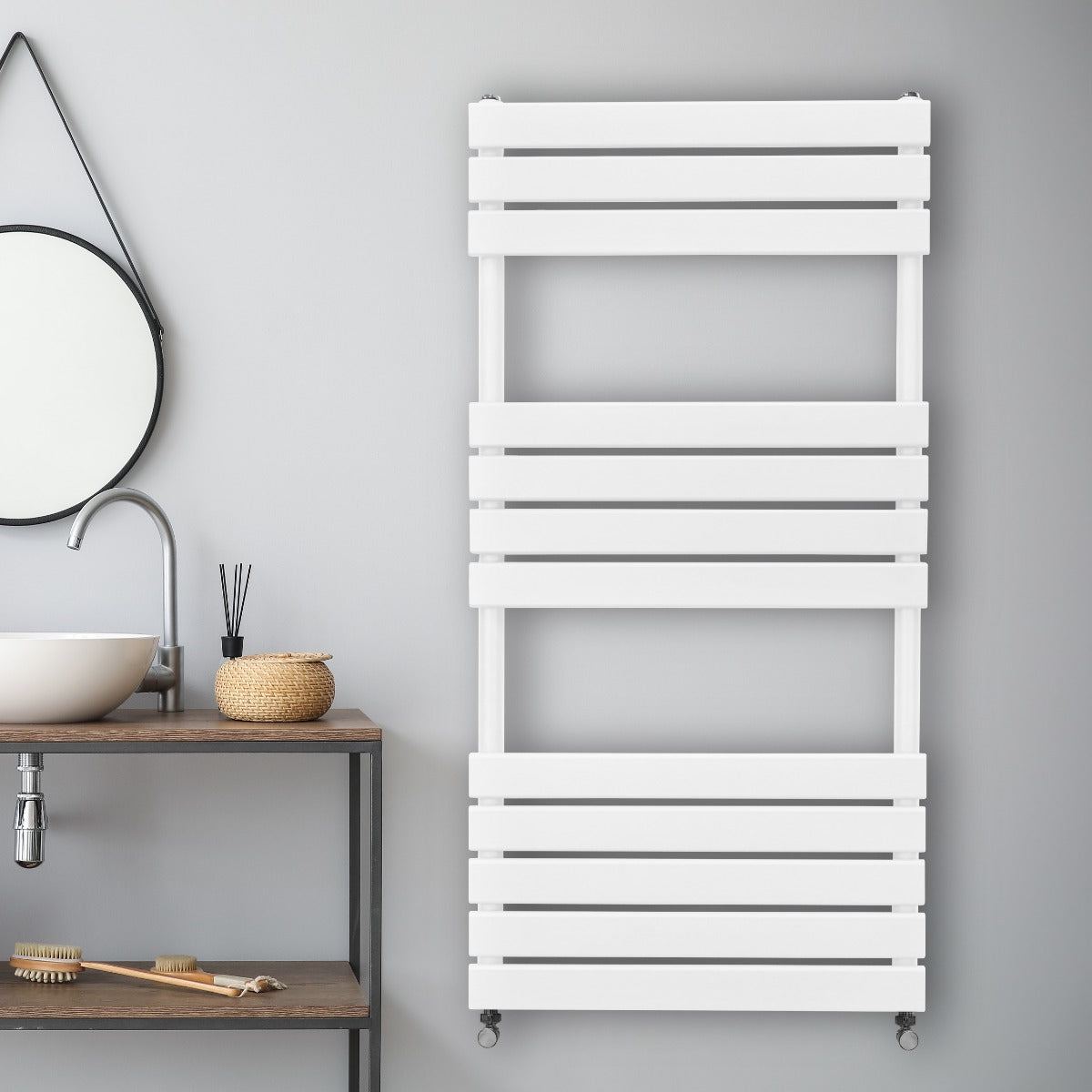Sleek white flat panel towel radiator with horizontal slats, mounted on a gray wall, enhancing modern bathroom decor