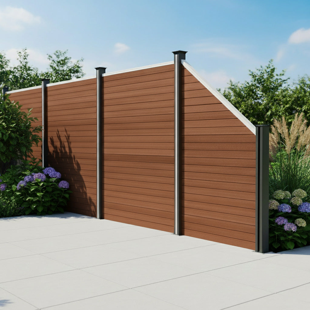 Composite angled fence panel in rich brown, featuring sleek horizontal slats, black metal posts, and surrounded by lush greenery and flowers