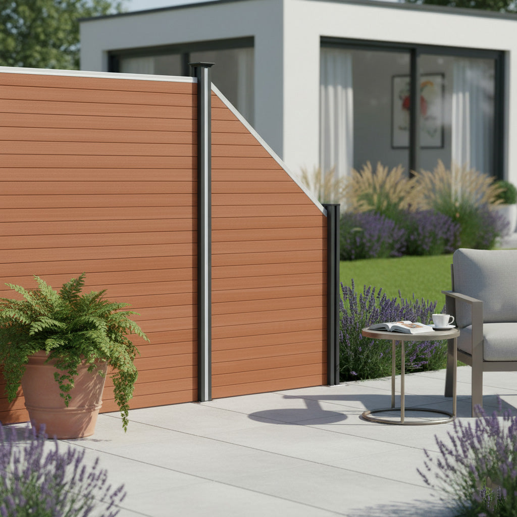 Brown composite angled fence panel with sleek lines, complemented by black posts, set in a modern outdoor space with greenery and lavender