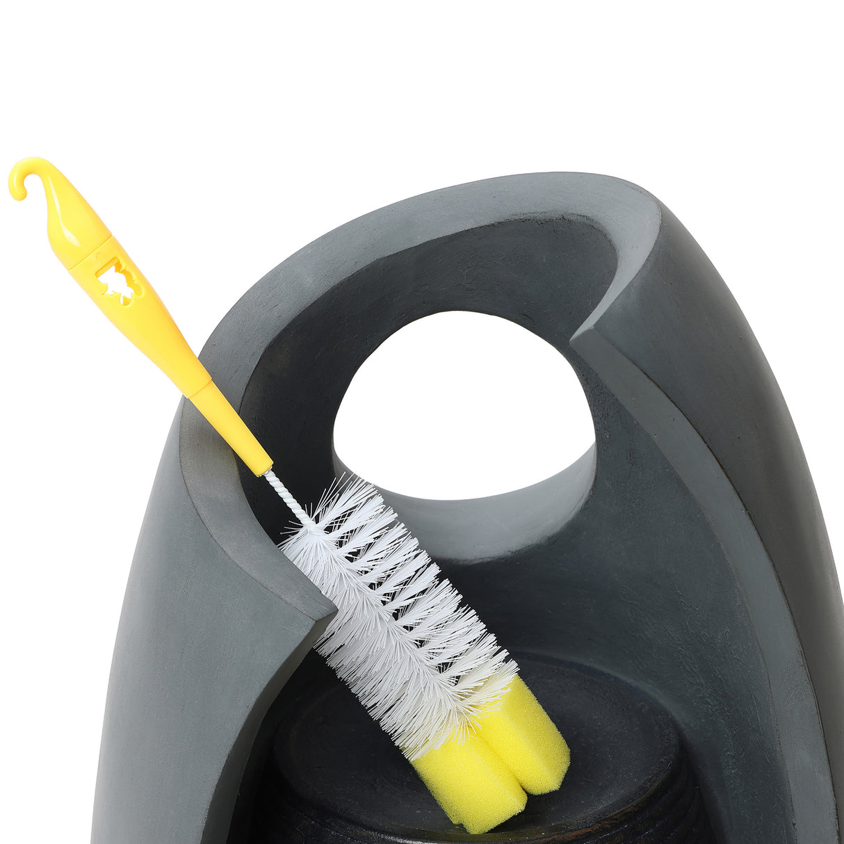 Sleek gray electric water feature with a modern design, featuring a yellow cleaning brush nestled in its curved opening