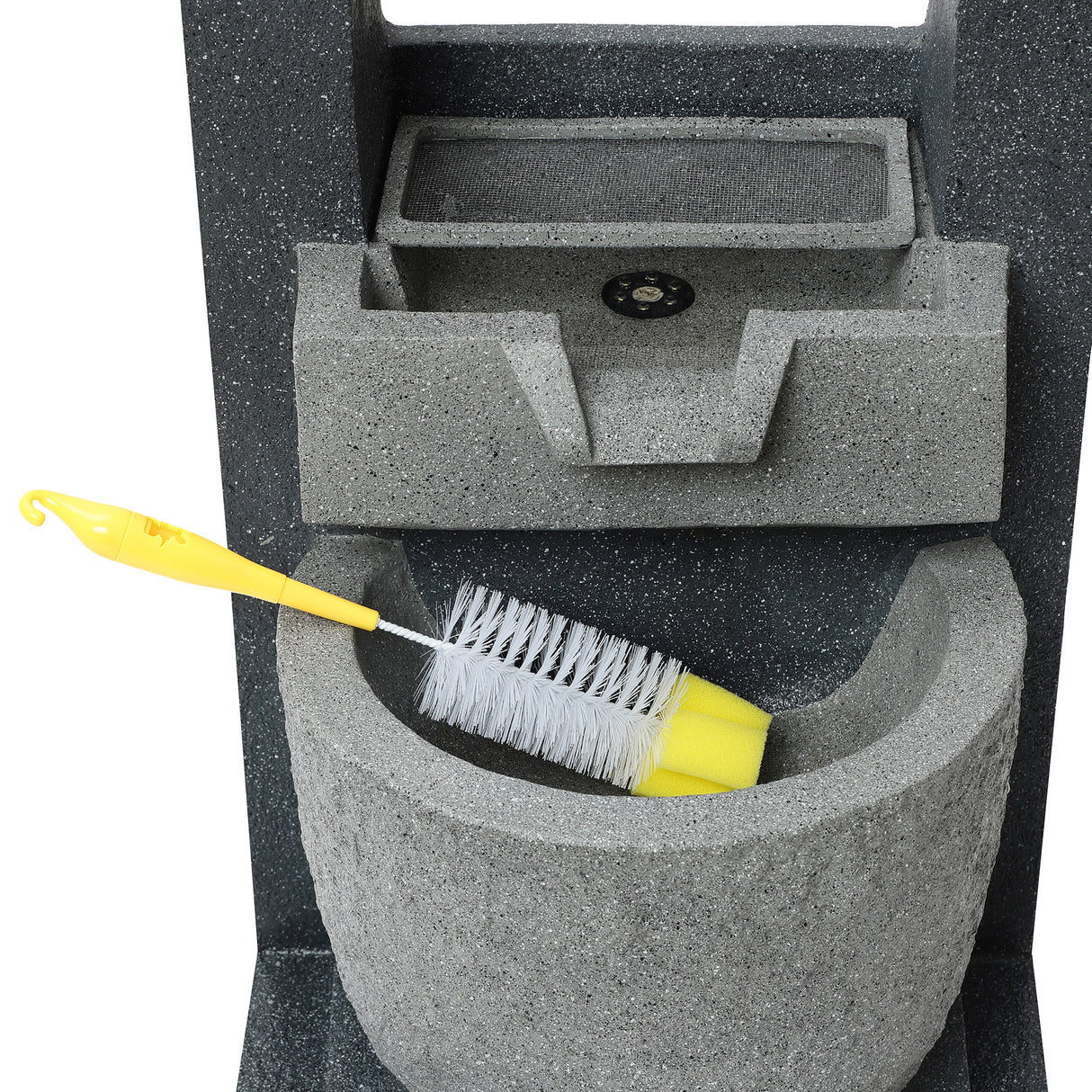 Gray electric water feature with a textured finish, featuring a built-in basin and a yellow cleaning brush resting inside