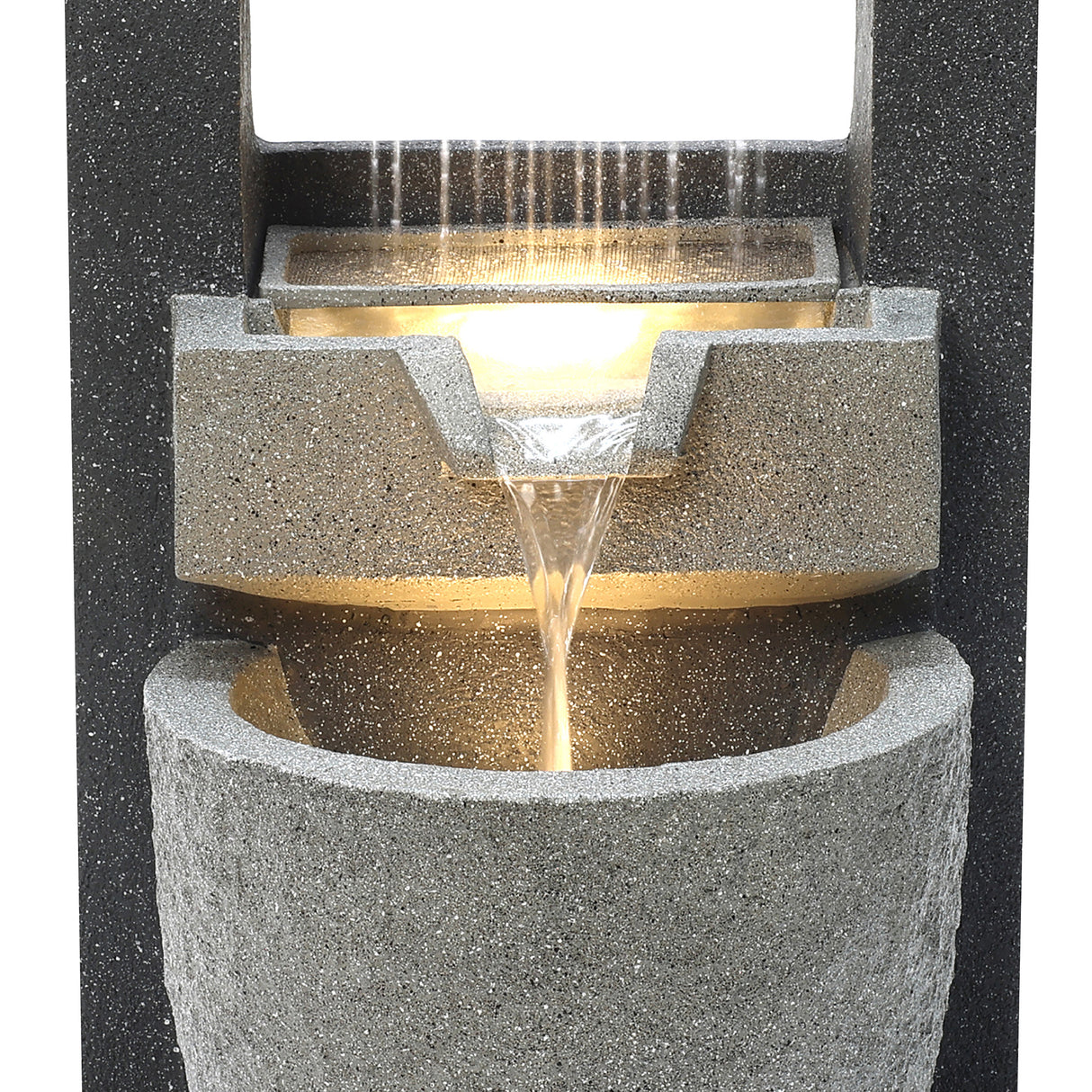Stylish electric water feature with cascading water, textured gray stone finish, and soft ambient lighting for a serene atmosphere
