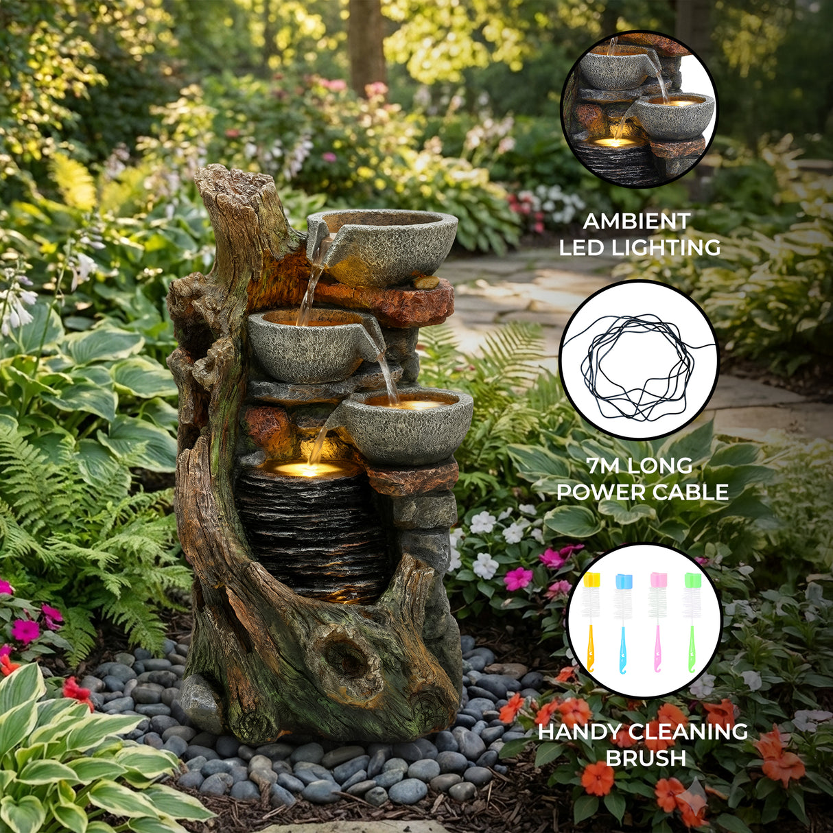 Rustic electric water feature with cascading bowls, ambient LED lighting, and a natural stone finish, surrounded by vibrant greenery