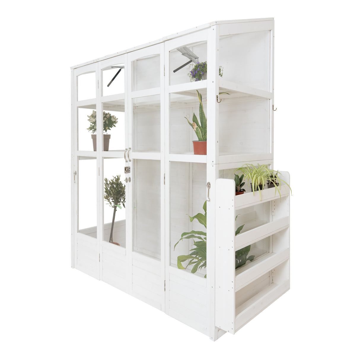 Victorian-style white greenhouse with glass panels, showcasing potted plants and a wooden shelf for gardening supplies