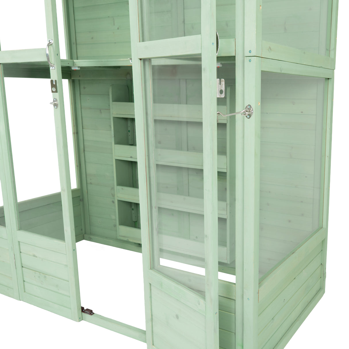 Victorian greenhouse in soft green wood, featuring glass panels, a spacious interior, and multiple shelves for plants and gardening tools