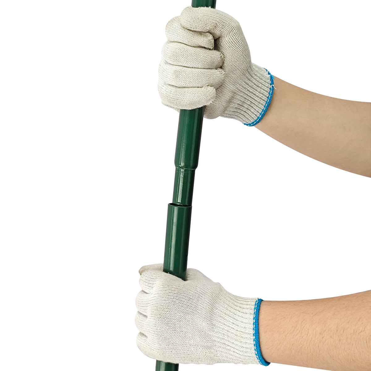 Hands in gray gloves gripping a green 100cm lawn leveller, showcasing its sturdy design and ergonomic handle for easy use