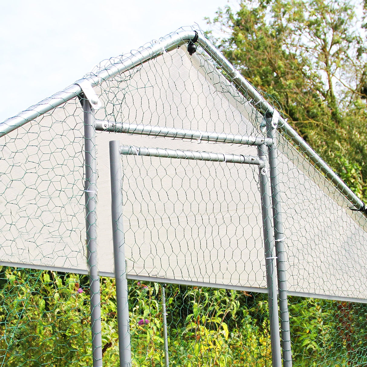 Durable chicken run featuring a sturdy metal frame, hexagonal wire mesh, and a weather-resistant cover, ideal for outdoor use