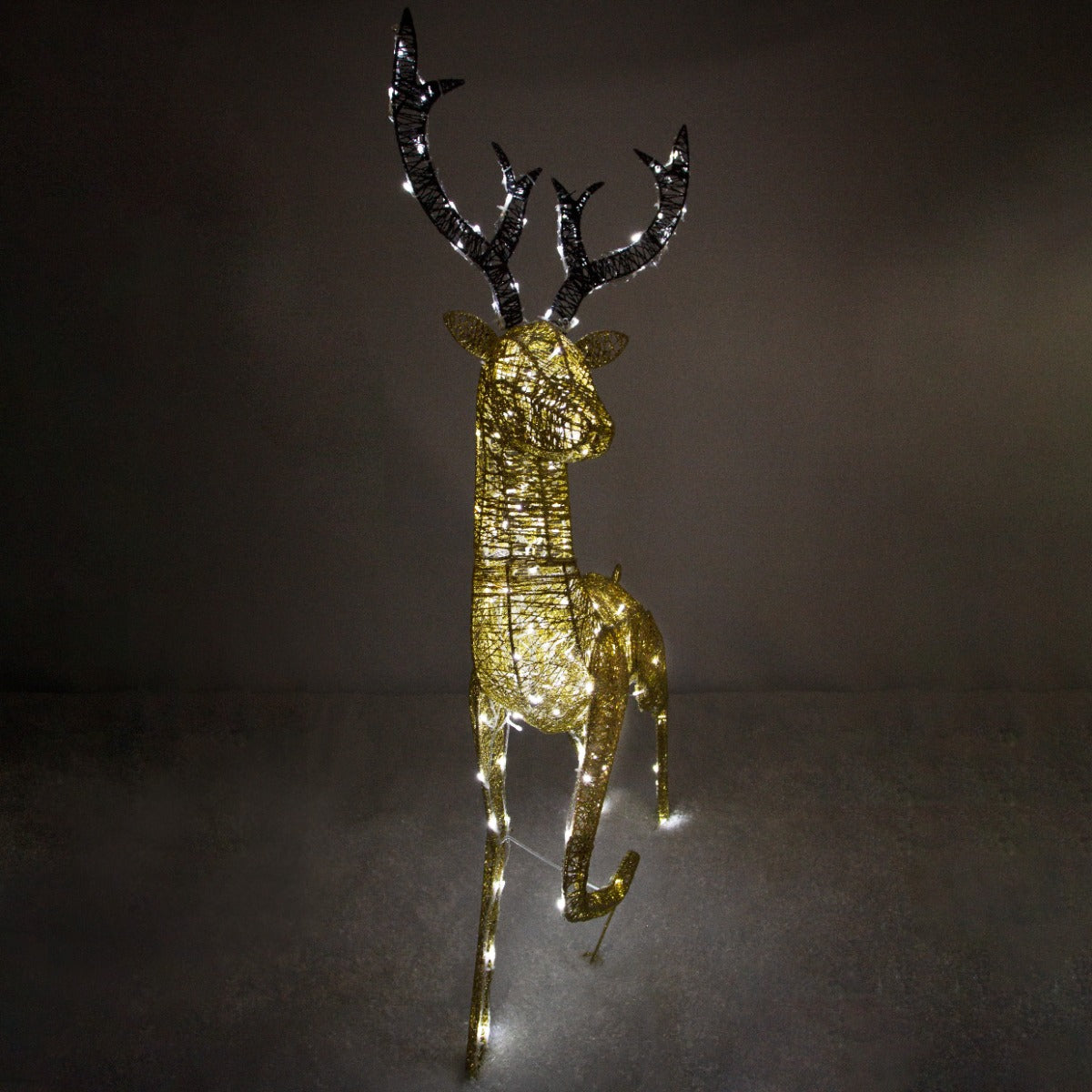 Elegant gold stag reindeer with intricate antlers, illuminated by 200 ice white LEDs, standing gracefully against a dark backdrop