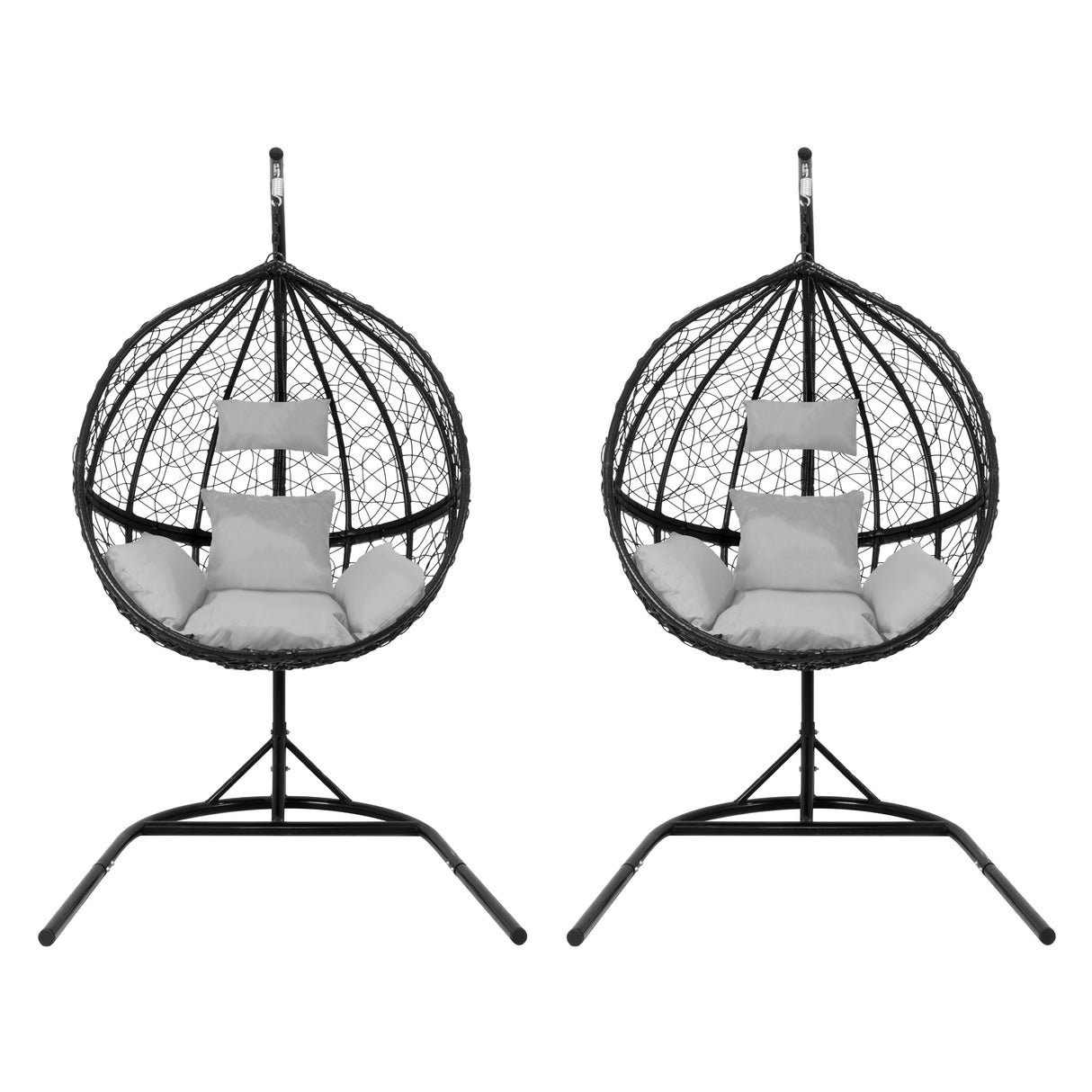 Two black hanging rattan egg chairs with plush white cushions, featuring a circular woven design and sturdy metal stands