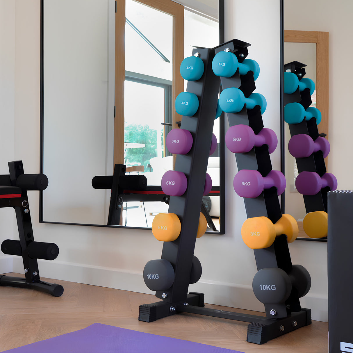 Colorful neoprene dumbbells in a sleek black rack, showcasing weights from 6kg to 10kg, set against a modern gym backdrop