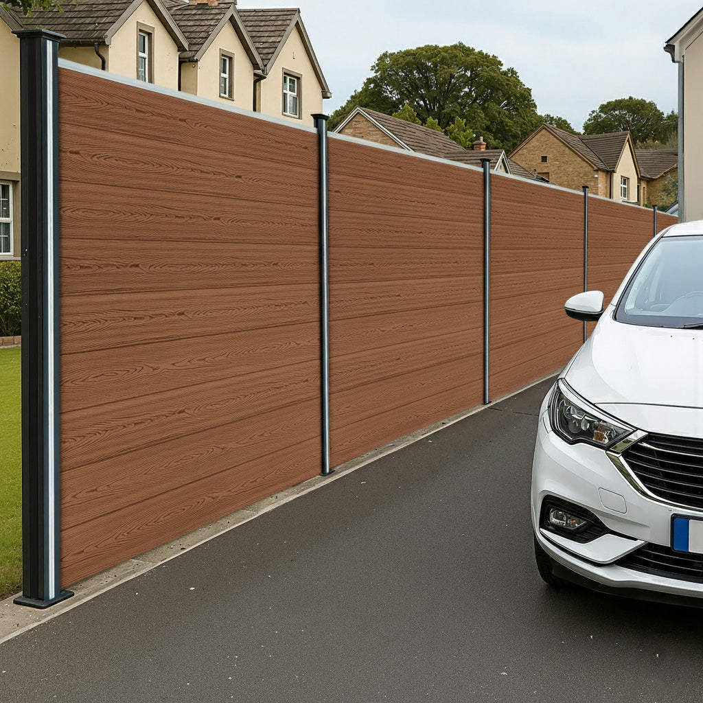 Brown composite fence panels with angled pieces and LED posts, showcasing a smooth wood-like texture and modern design, alongside a parked car