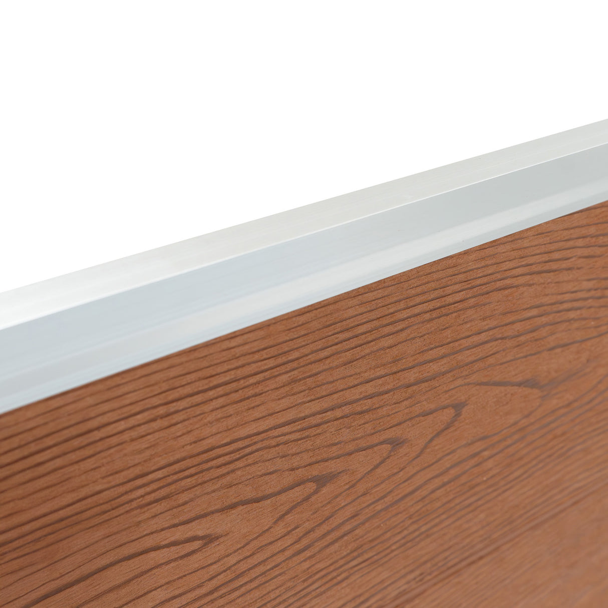 Brown composite fence panel with a textured wood grain finish and a sleek aluminum top rail, showcasing durability and modern design