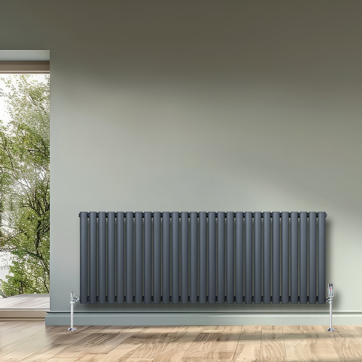 Sleek black oval single column radiator, 600mm x 1440mm, mounted on a wall with a modern, minimalist design and wooden floor