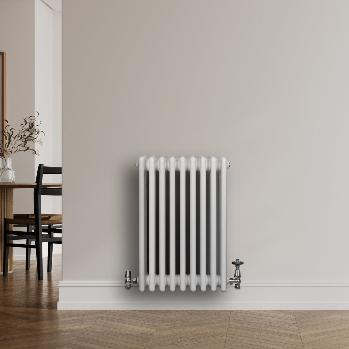 Traditional white 4 column radiator with smooth, rounded edges, positioned against a neutral wall in a modern interior setting