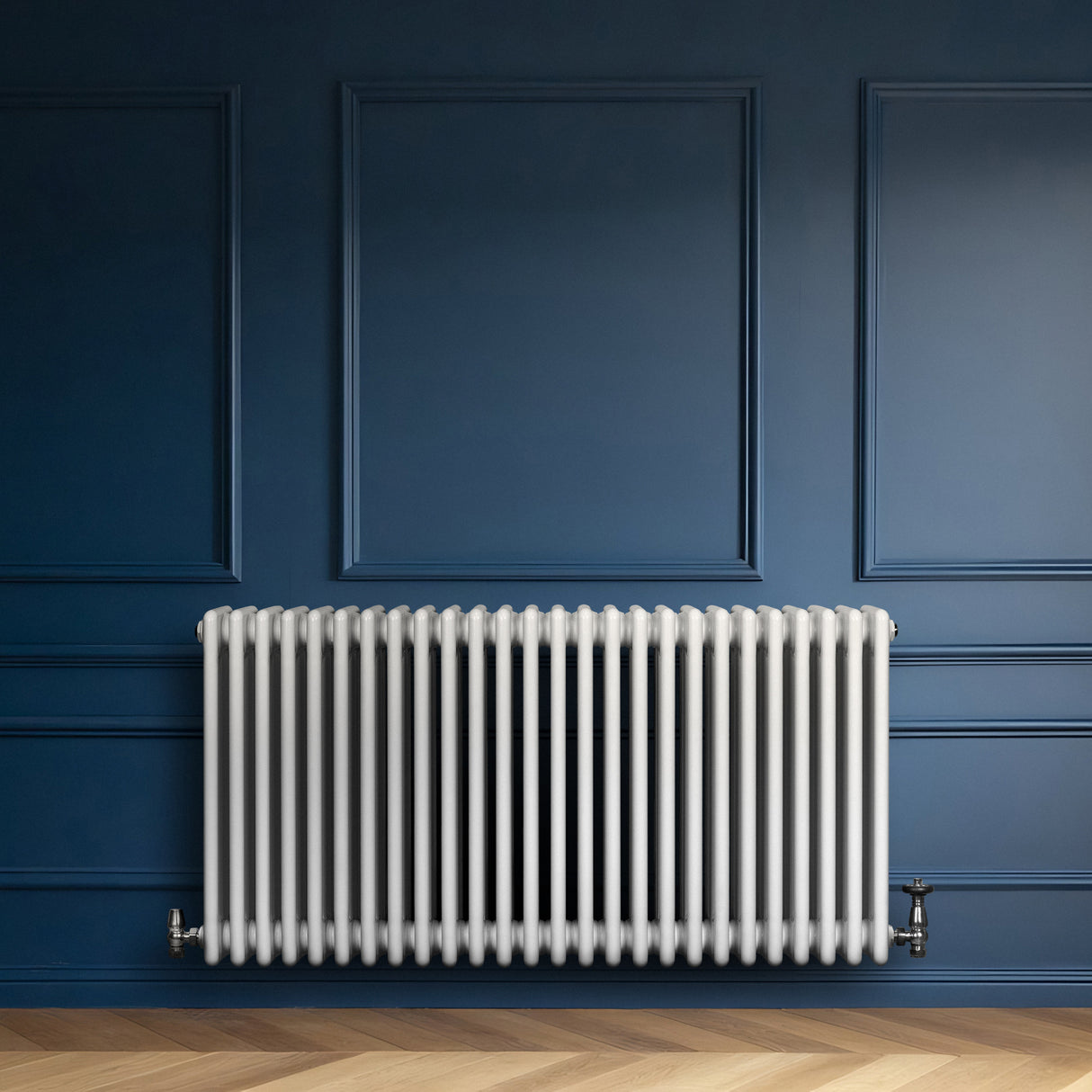 Traditional white 4 column radiator with a sleek, smooth finish, mounted against a deep blue wall, enhancing any room's decor