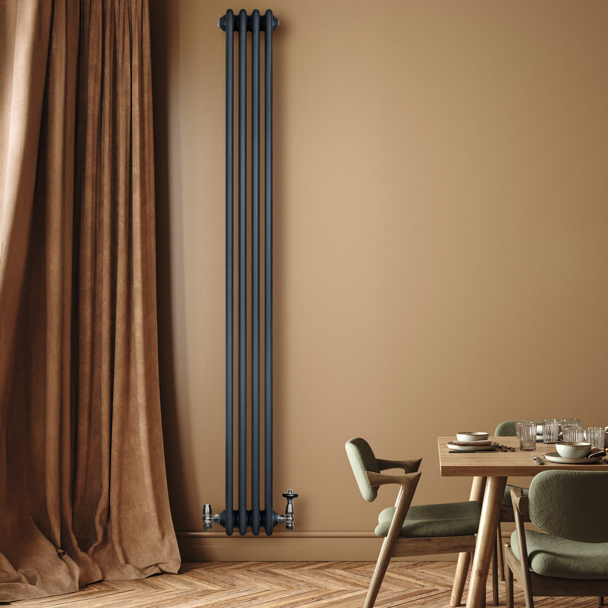 Traditional anthracite grey 4 column radiator mounted on a beige wall, complementing a cozy dining area with wooden flooring and green chairs