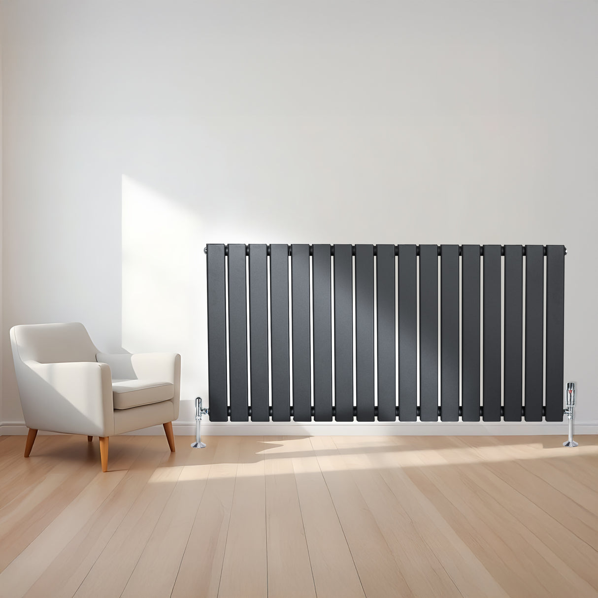 Flat single column radiator in anthracite grey, featuring vertical slats, sleek design, and positioned beside a modern armchair on light wood flooring