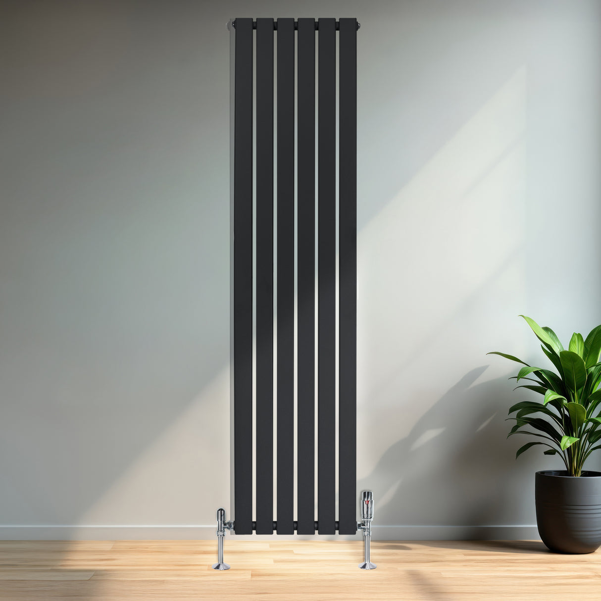 Tall anthracite grey flat single column radiator with sleek vertical lines, mounted on the wall, enhancing a modern interior space
