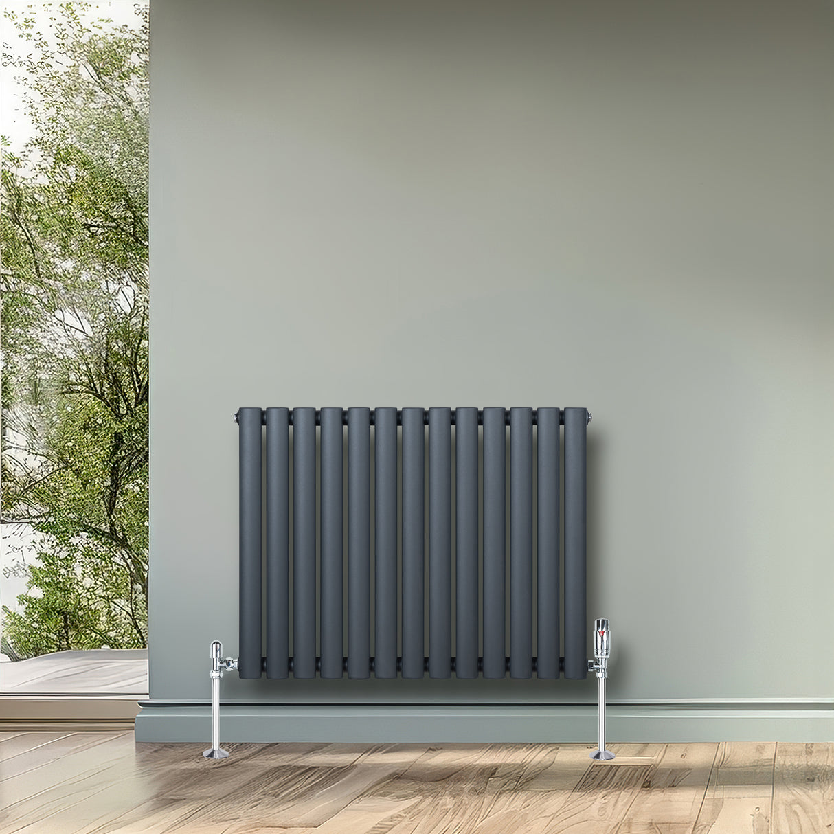 Anthracite grey oval single column radiator with vertical tubes, mounted on a wall, complementing a modern interior design
