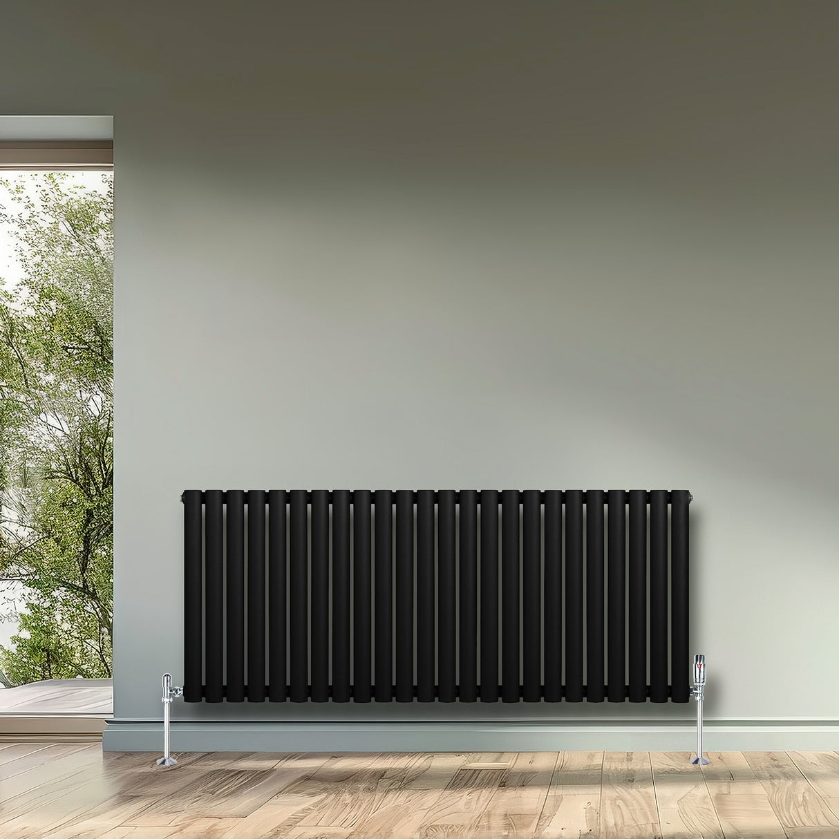 Sleek black oval single column radiator, 600 x 1440mm, featuring vertical stripes and polished chrome feet, enhancing modern interiors