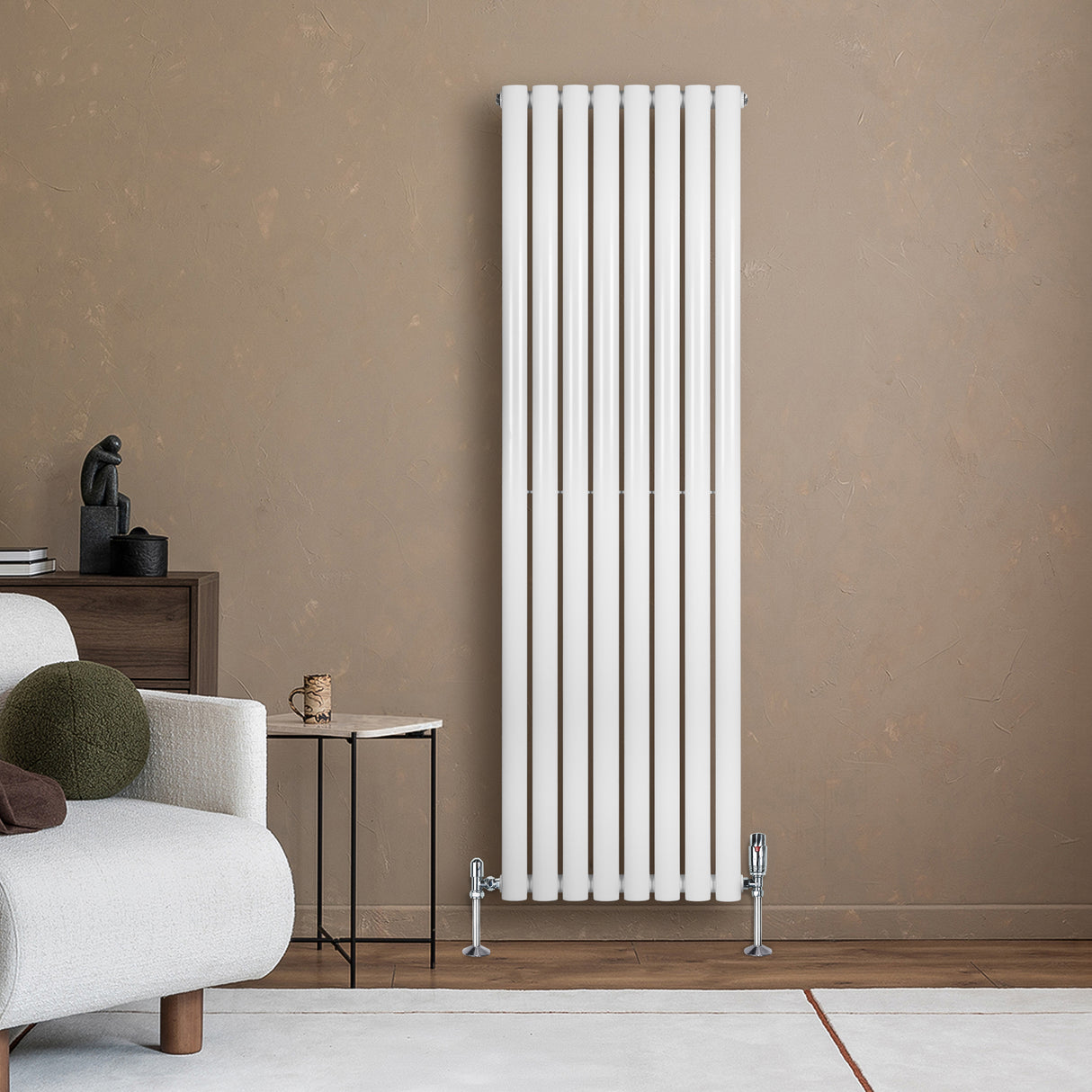 Sleek white oval single column radiator, 1600 x 480mm, mounted against a warm beige wall, enhancing modern interior decor