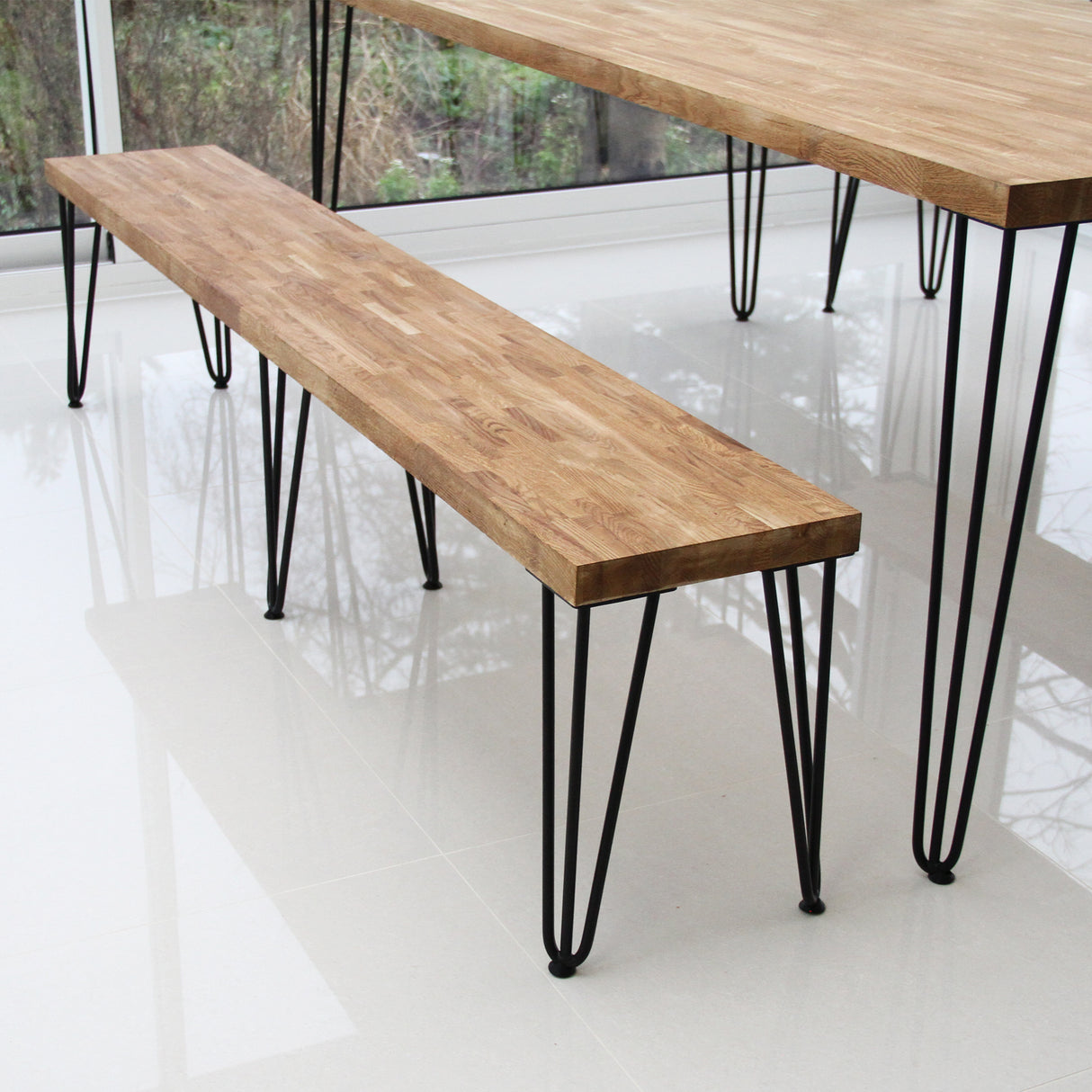 Black 12mm hairpin leg feet protectors for furniture, featuring sleek metal design and sturdy construction, ideal for tables and benches