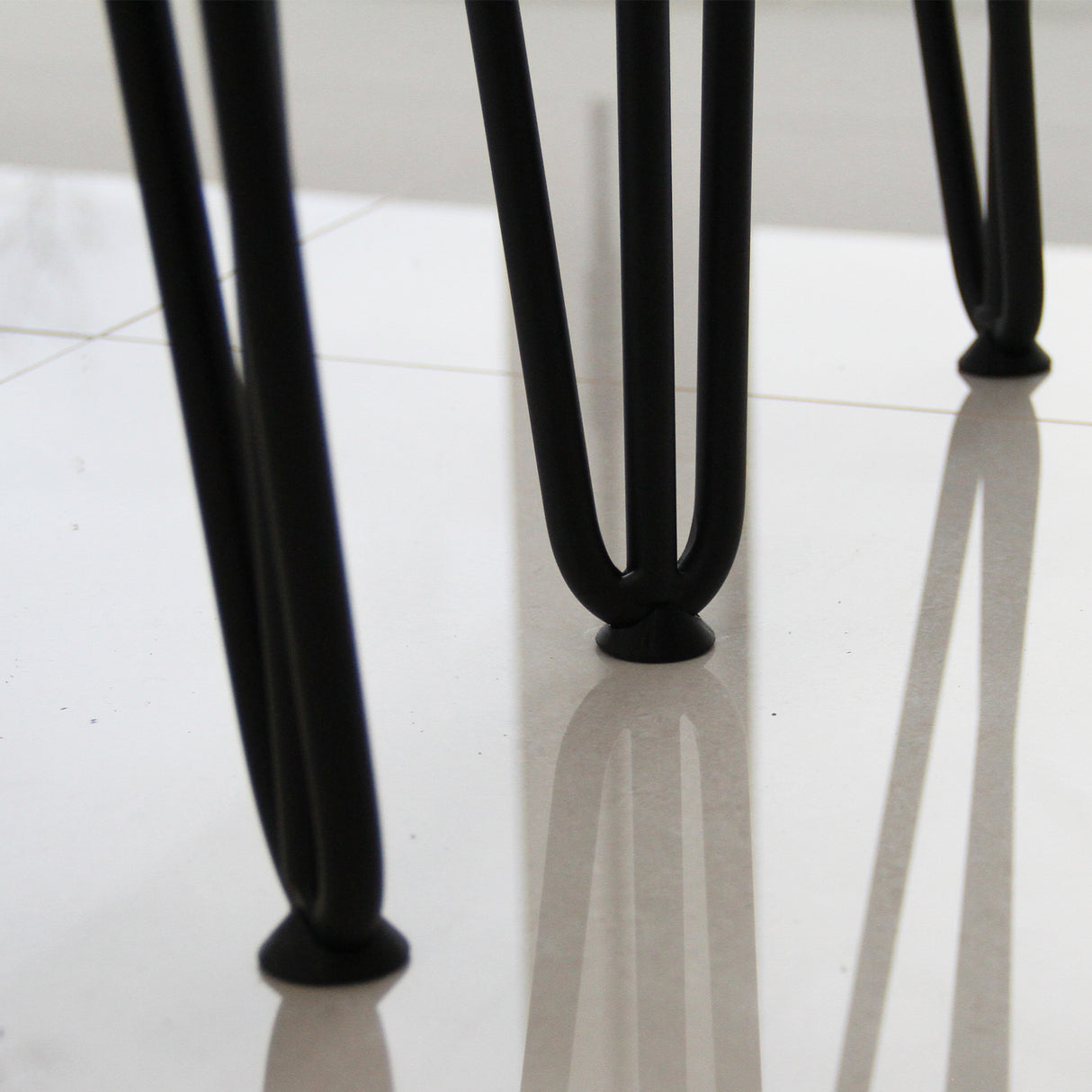 Grey 10mm hairpin leg feet protectors with a sleek design, featuring a smooth finish and rounded bases for stability on floors
