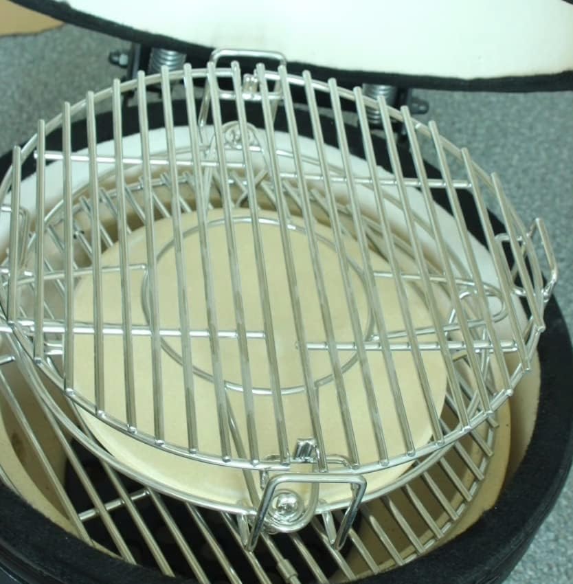 Stainless steel grill grate with circular ceramic heat deflector, designed for the Fresh Grills Kamado cooking system