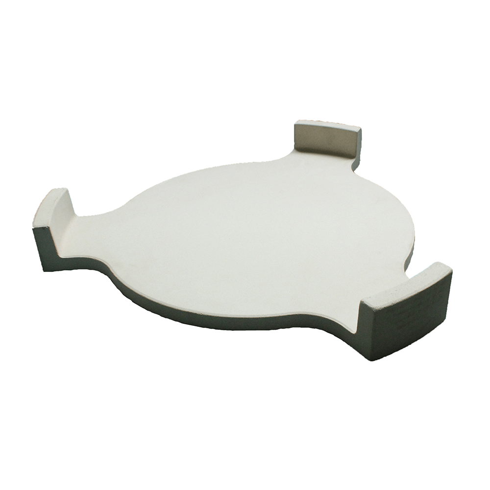 Round, white ceramic heat deflector for Kamado grills, featuring curved edges and a smooth, glossy finish for even heat distribution