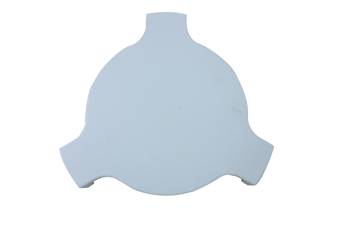 Round, white ceramic heat deflector for Kamado grills, featuring smooth texture and curved edges for even heat distribution