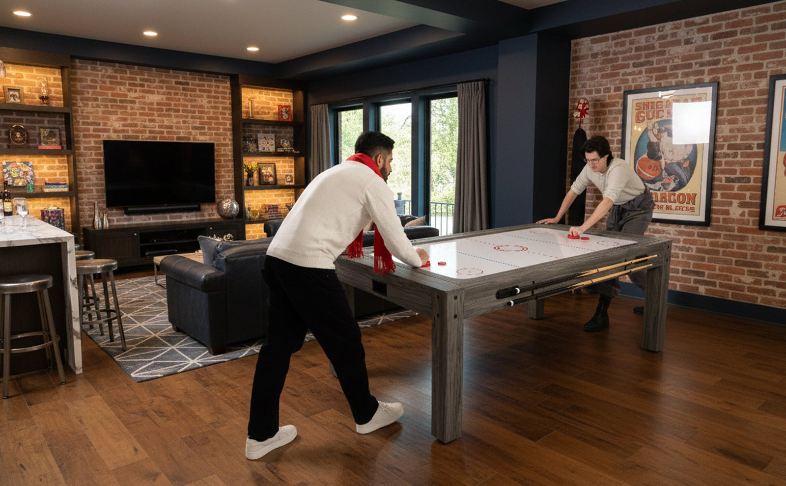 Modern 7-in-1 games table in a stylish living room, featuring a sleek gray finish, players engaged in air hockey, and warm lighting