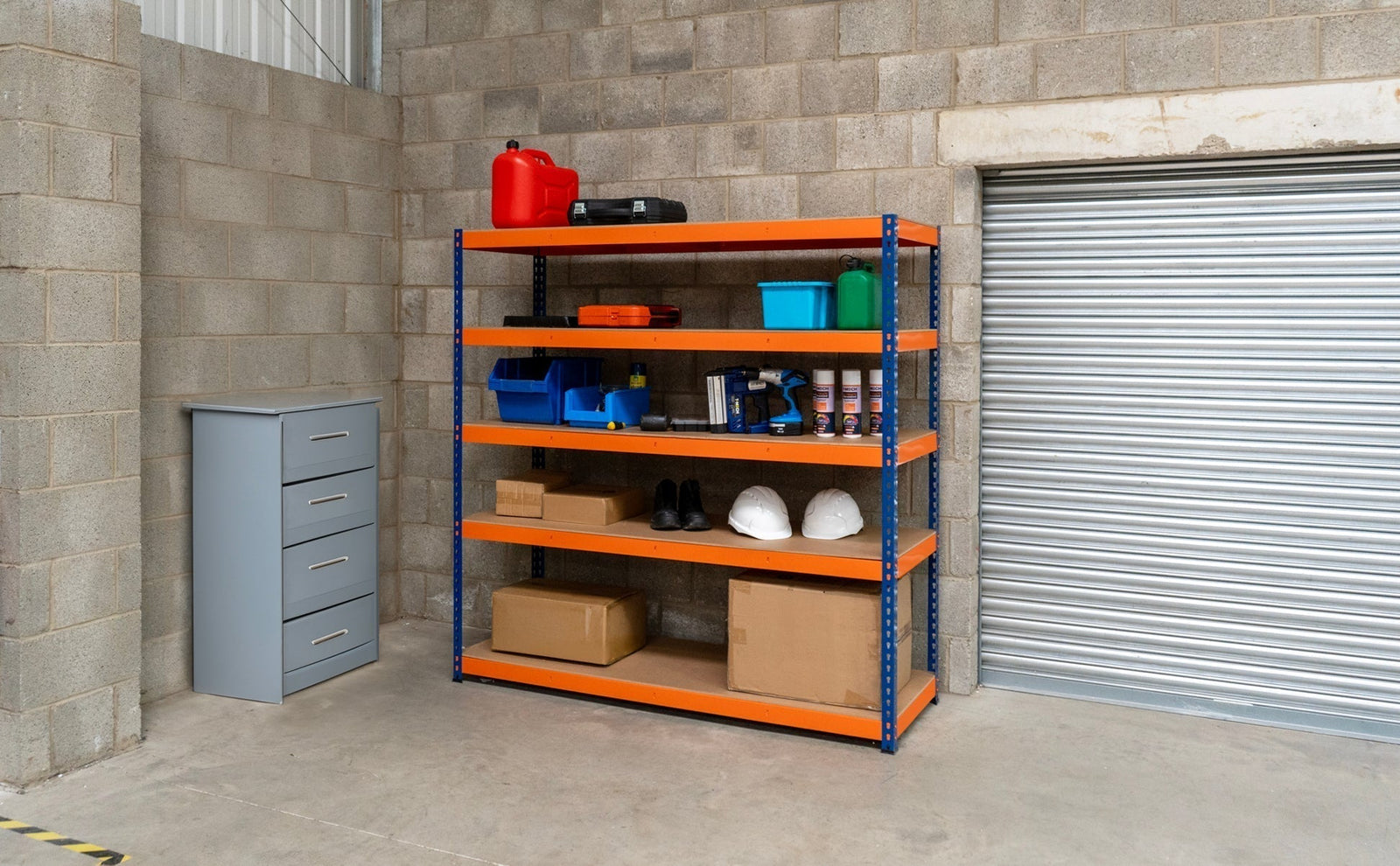 Brightly colored shelving unit with tools, storage bins, and safety gear against a concrete wall in a tidy workspace