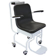 Commercial disability wheelchair scales with a sturdy white metal frame, black padded seat, armrests, and smooth rolling wheels
