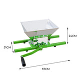 Sturdy green fruit crusher with a large aluminum hopper, measuring 57cm wide, 31cm long, and 24cm high, ideal for juicing fruits