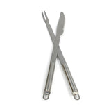 Stainless steel carving fork and knife set with ergonomic handles, perfect for serving and slicing hog roasts and meats
