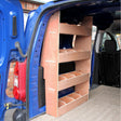 Plywood storage shelves designed for Peugeot Partner SWB van, featuring three open compartments and a smooth, natural wood finish
