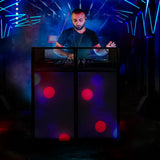 A DJ stands behind a sleek black booth with colorful lights and vibrant bokeh effects, creating an energetic party atmosphere