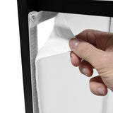 Hand adjusting a white fabric panel on a sleek black DJ disco booth, showcasing its modern design and versatility