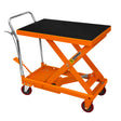 Hydraulic table lift with a sturdy black rubber top, bright orange frame, and smooth-rolling wheels for easy mobility