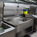 Stainless steel catering sink with a left-hand drainer, featuring a smooth surface, modern design, and industrial-grade durability