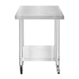 Stainless steel work table with a smooth surface, sturdy legs, and wheels for easy mobility, measuring 60cm x 45cm x 86cm