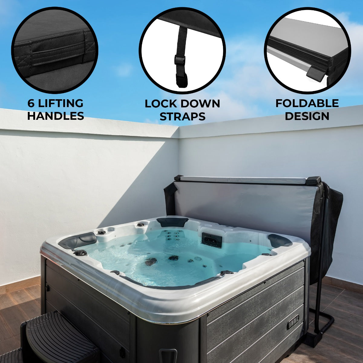 Black 2m hot tub spa cover with six lifting handles, lock down straps, and a foldable design, set against a clear blue sky