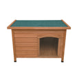 Small wooden dog kennel featuring a sloped green roof, sturdy construction, and an arched entrance for easy access