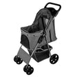 Grey pet stroller featuring a rain cover, spacious mesh compartment, sturdy wheels, and a comfortable handle for easy maneuvering