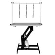 Black hydraulic grooming table with a grey top, featuring adjustable height and three grooming loops for secure pet handling